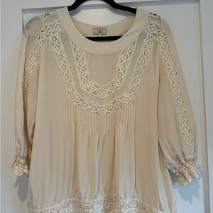 Aloe Silk Top in ivory with embroidery and 3/4 sleeves. Size Small (1).